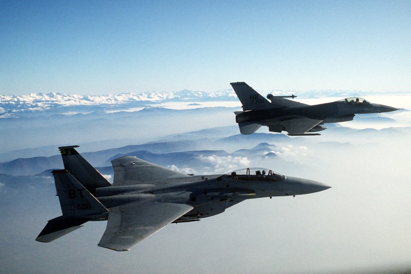 An air-to-air right side view of a 50th Tactical Fighter Wing F-16A Fighting Falcon aircraft in formation with a 36th Tactical Fighter Wing F-15D Eagle aircraft during a dissimilar aircraft combat tactics exercise.