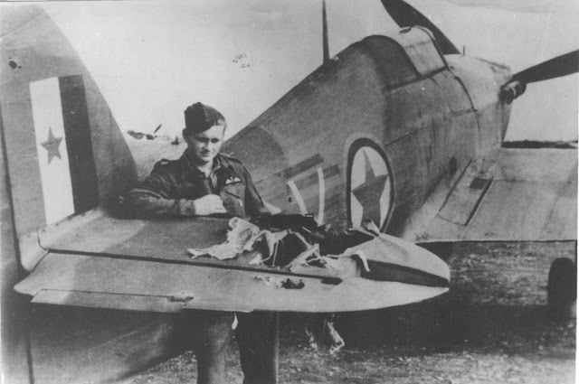 Yugoslavian pilot Tugomir Prebeg stands by his Hawker Hurricane damaged during a ground attack mission in 1944